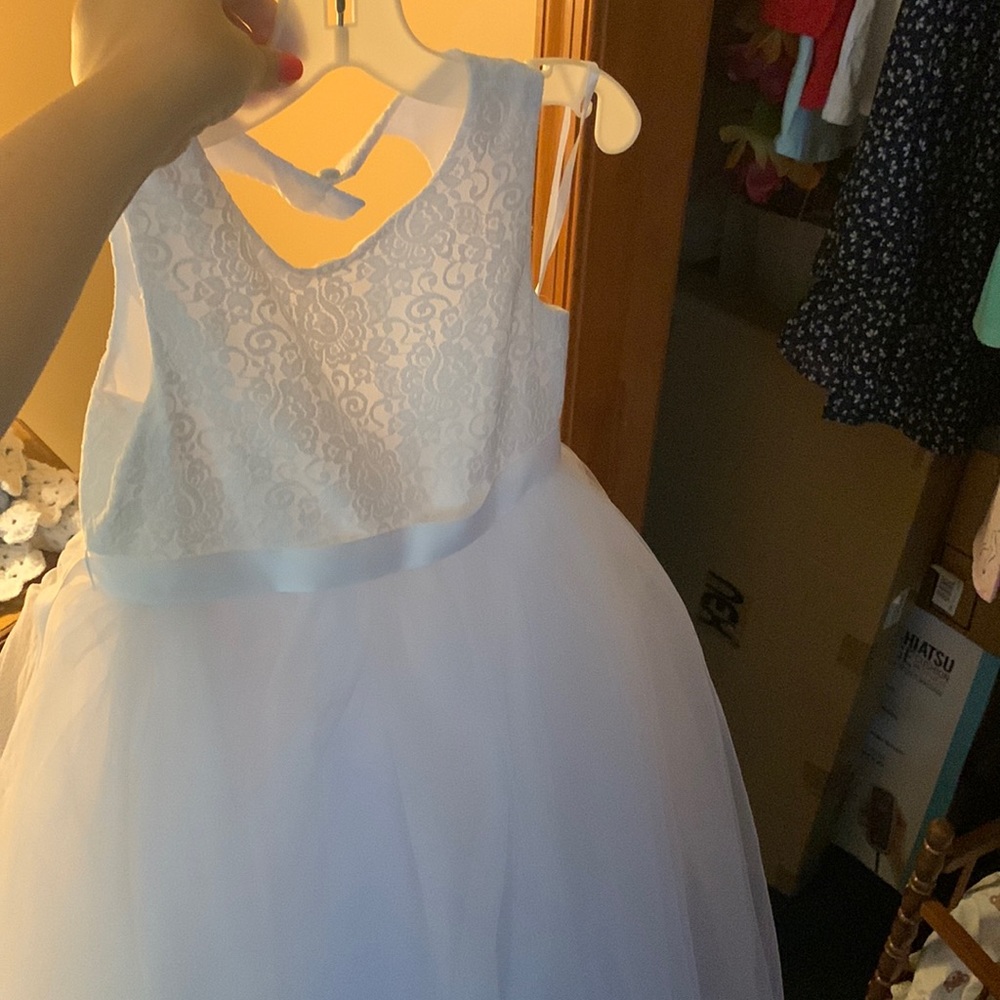 Brand new never used flower girl dress with heart shape cut out in the back